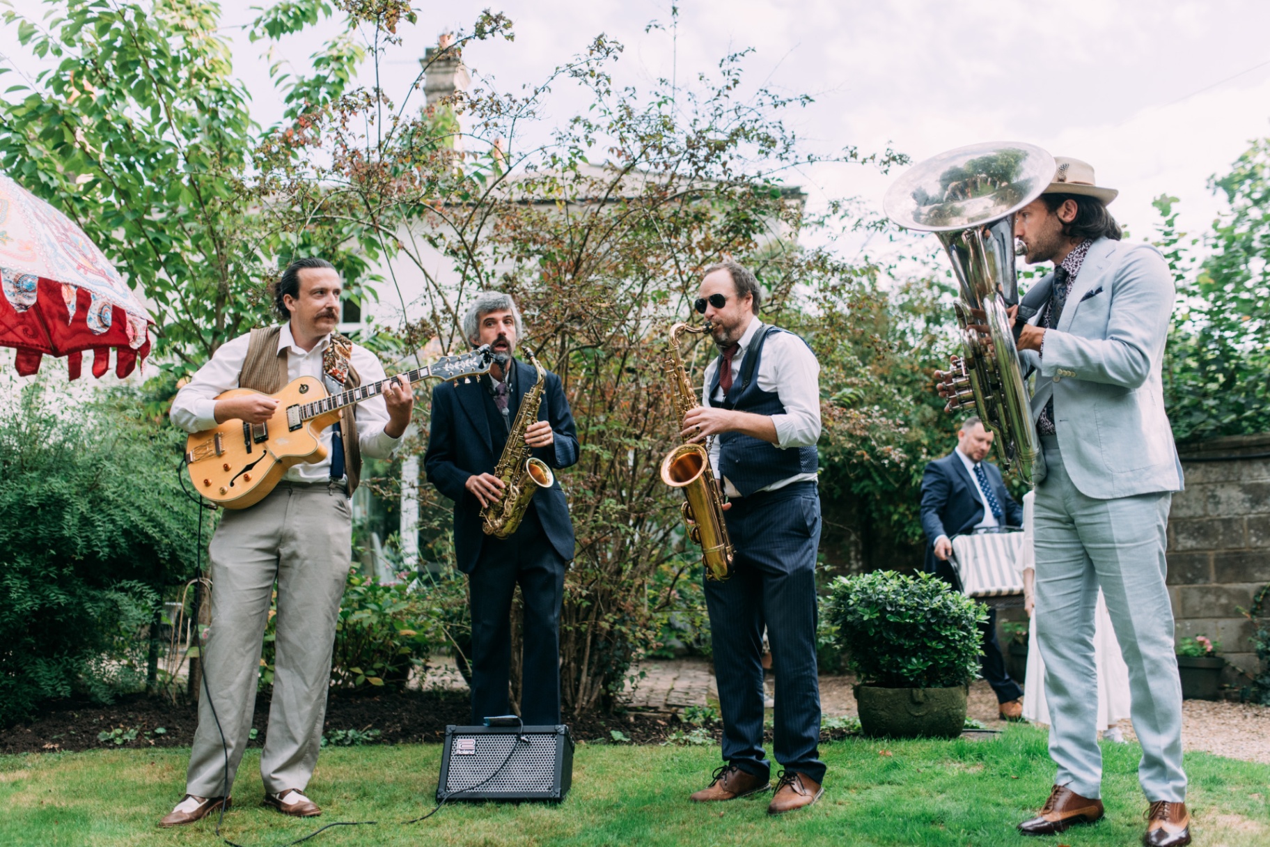 Live band performing outdoors at an elegant garden celebration